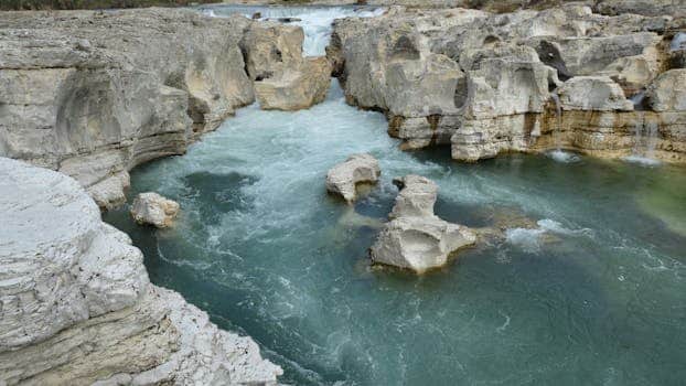 Beautiful river flowing through limestone formations in La Roque-sur-Cèze, France.